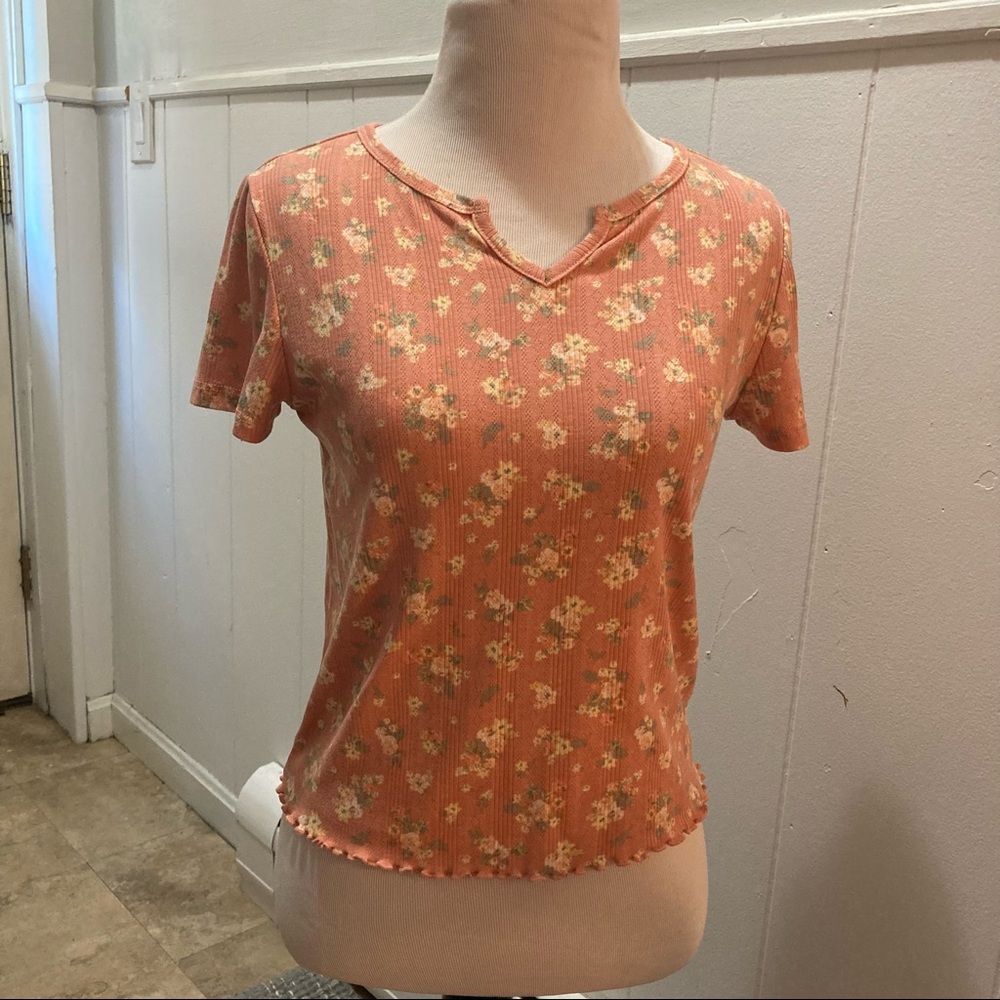 Coral top with floral pattern
